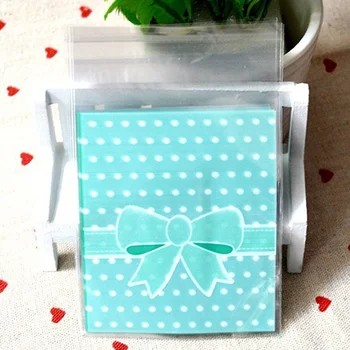 

100Pcs 8cm*10cm+3cm Cute Bow-tie design Gift Food Plastic Bags Cute Small Biscuit Bag Party Favor Cellophane Bags