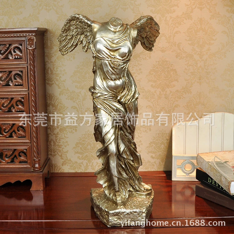 headless angel statue louvre