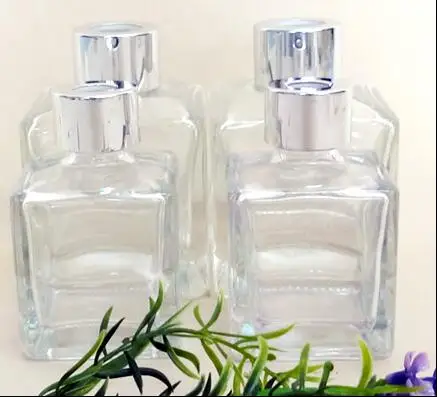 

50pcs whoesale 100ml clear glass aromatherapy bottl with shiny silver aluminum lid