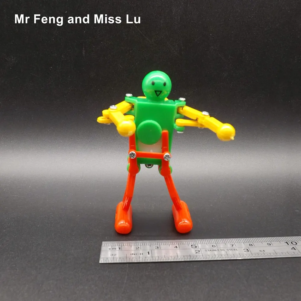 Spring Wind-up Girls Boys Walking Clockwork Gift Toy Dancing Robot Children