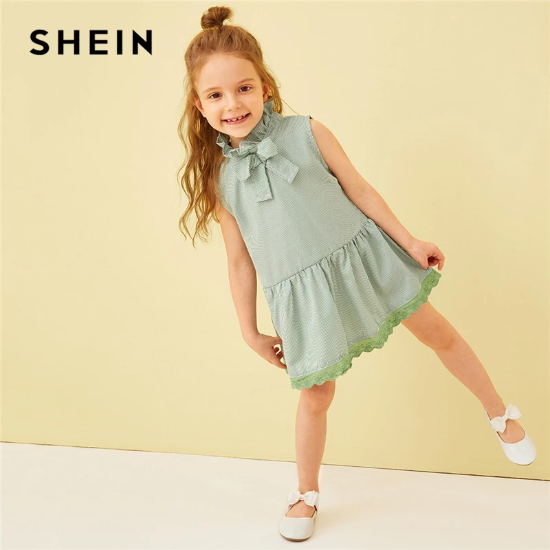 SHEIN Kiddie Green Striped Frilled Tie Neck Lace Hem Girls Cute Dress Summer Sleeveless Button Back A Line Kids Short Dresses SHEIN Kiddie Green Striped Frilled Tie Neck Lace Hem Girls Cute Dress Summer Sleeveless Button Back A Line Kids Short Dresses