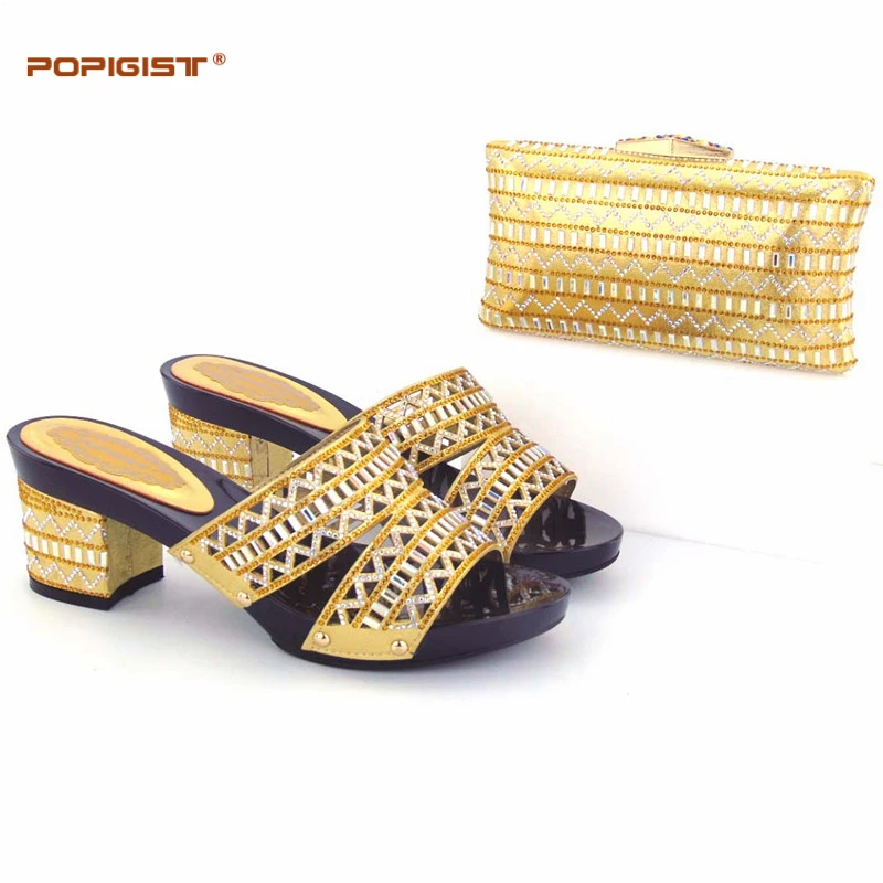 gold heels and clutch