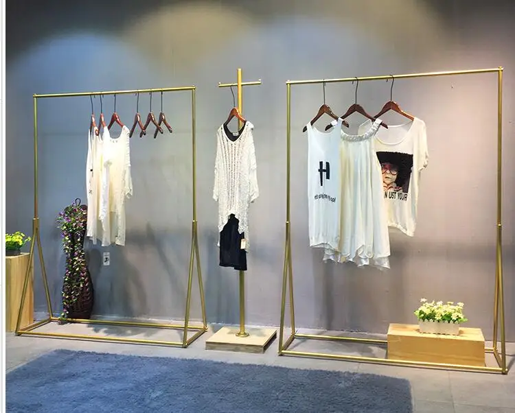 

Clothing store display rack gold clothing rack women's wear store shelf hanging clothes rack clothes rack iron art simplicity.