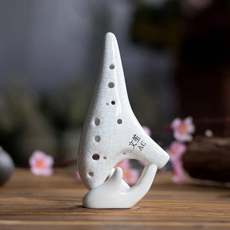

Pure white AC adjustable new ice crack crack 12 hole ocarina is suitable for the school band