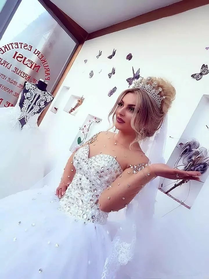 2018-luxury-crystals-beaded-ball-gown-wedding-dresses-sheer-neck-sweetheart-neck-long-sleeve-tulle-princess-plus-size-bridal-gowns.webp (1)_