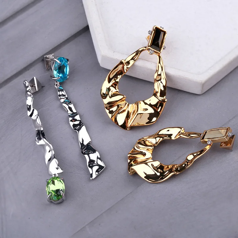 

European and American Designer Style Copper folded ring asymmetric Earrings metal cold wind irregular Earrings