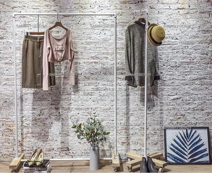 Clothing store display rack. Clothes rack women's shop floor-to-floor hangers. Solid wood Textile Gondola simple white gantry.