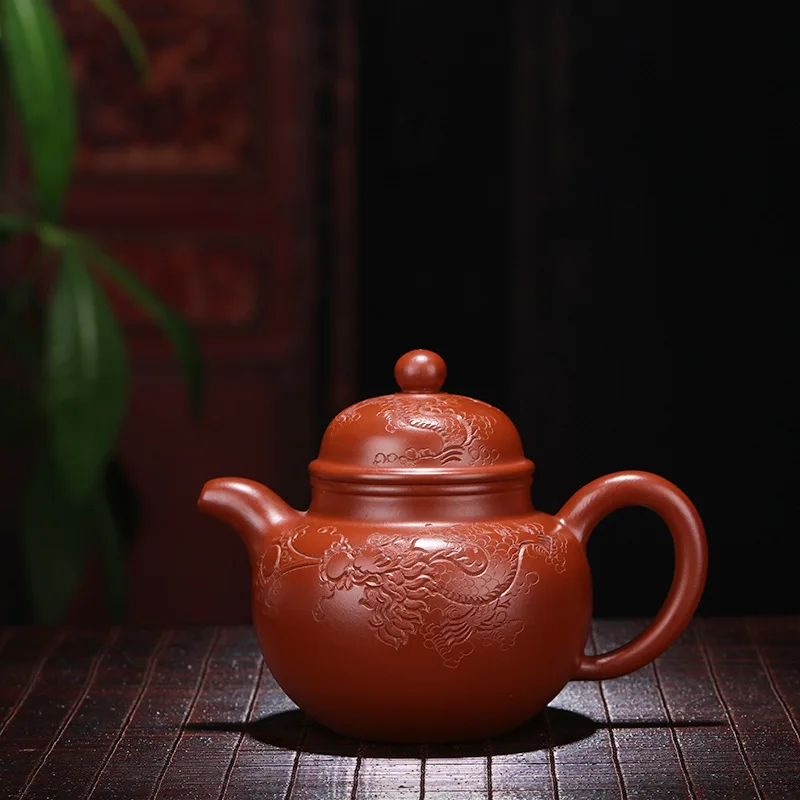 

Yixing Yixing Teapot Tea Set Wholesale Famous Full Manual Raw Ore Bright Red Gown Engraved Ball Pot Sincere Recruit Agent