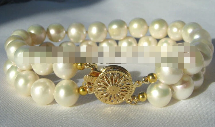 

0510 white round freshwater pearl bracelet-GP clasp