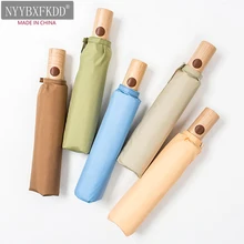 

Automatic Korean small fresh rain dual-use solid color wooden handle folding male retro goddess simple Sen female umbrella