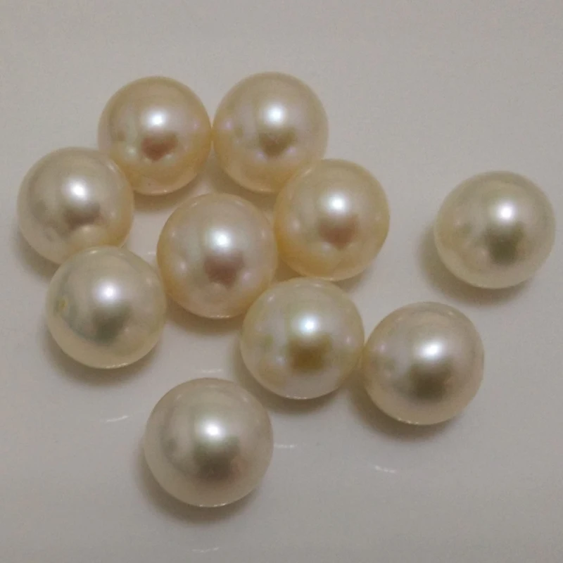 

10pcs of 4mm,36pcs of 6mm,20 pcs of 8mm,6pcs of 10mm natural half drilled loose round freshwater pearls