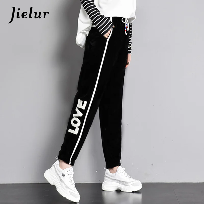 black trousers with red side stripe