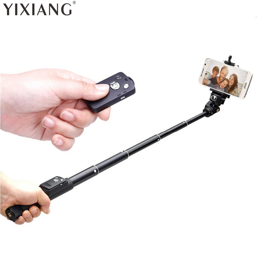 крепление телефона на селфи палку. управление селфи палкой. селфи палка. штатив selfie stick tripod. крутящаяся селфи палка.