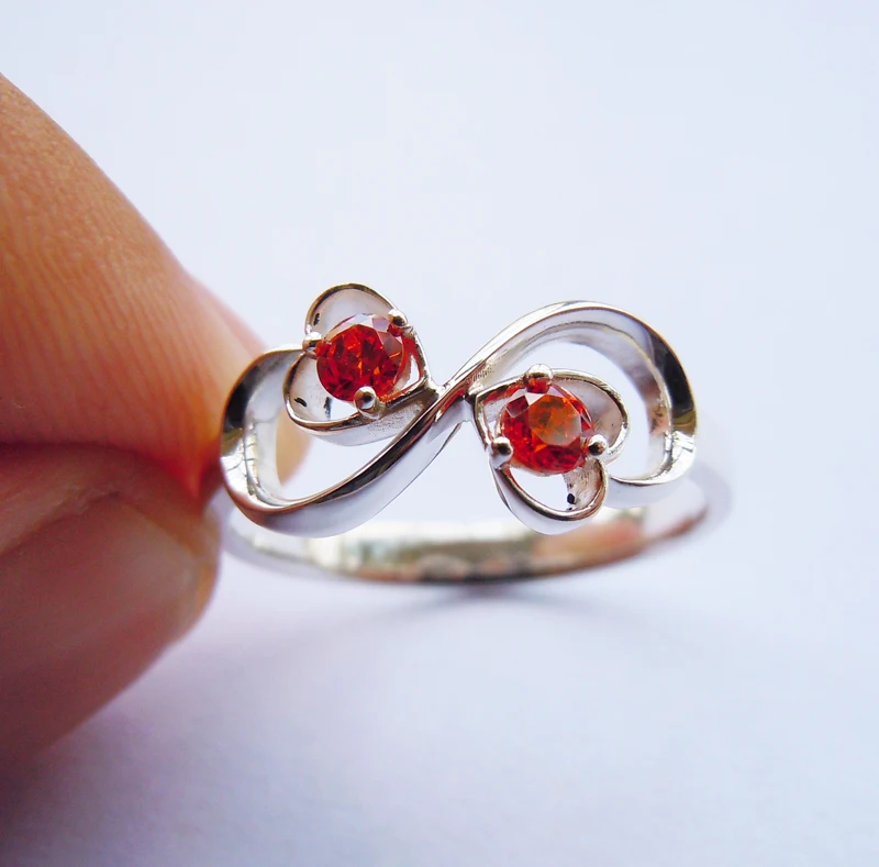 

Infinity Ring in Solid Sterling Silver&Orange CZ stones All Sizes