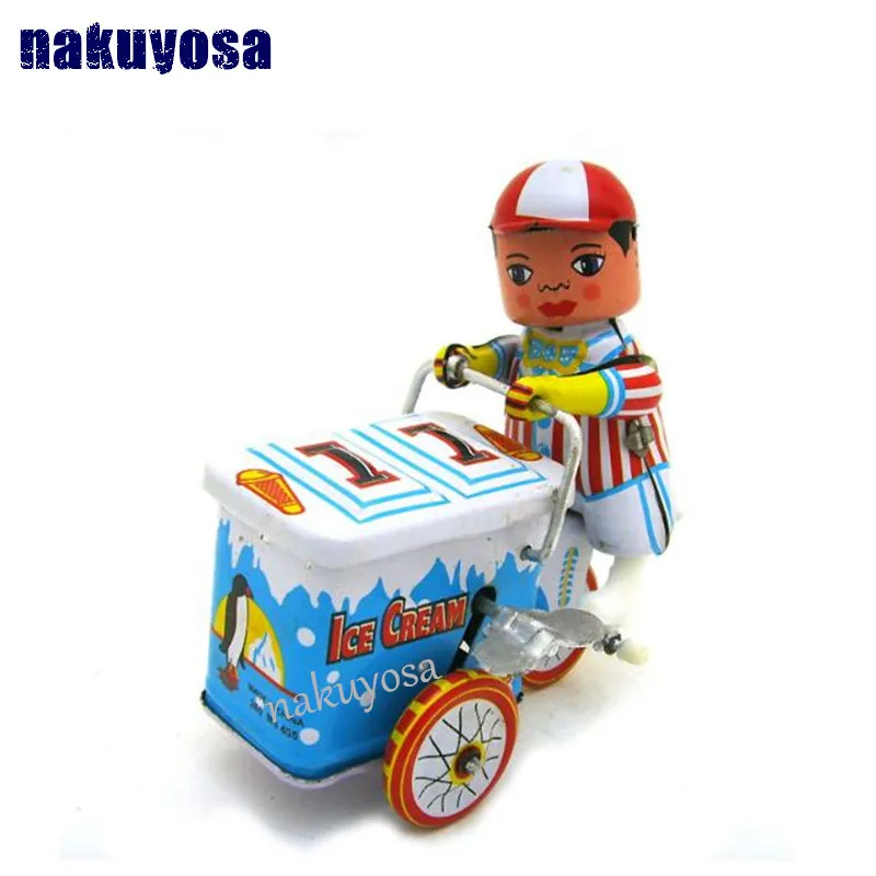 

Metal Ice cream car robot child Riding a tricycle Photography props clockwork toys