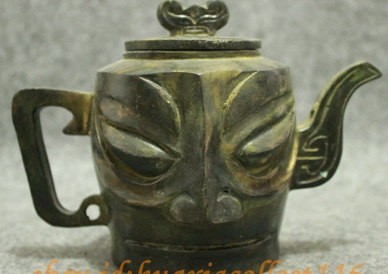 Старинная китайская бронза собирает sanxingdui человек лицо чайник скульптура горшок