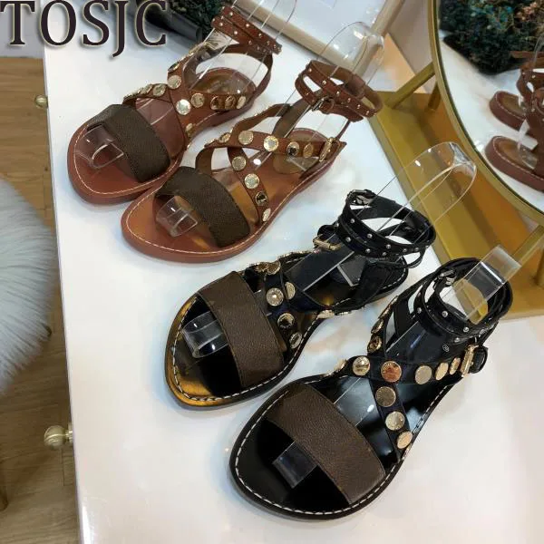 

Brand new women's sandal with rivets ladies flats heel sandal shoes high quality !