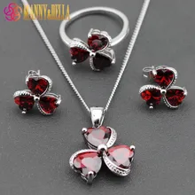 Комплект ювелирных украшений(серьги, подвеска, кольцо)с полудрагоценным камнем(темно-красный родолит). Серебро 925 пробы