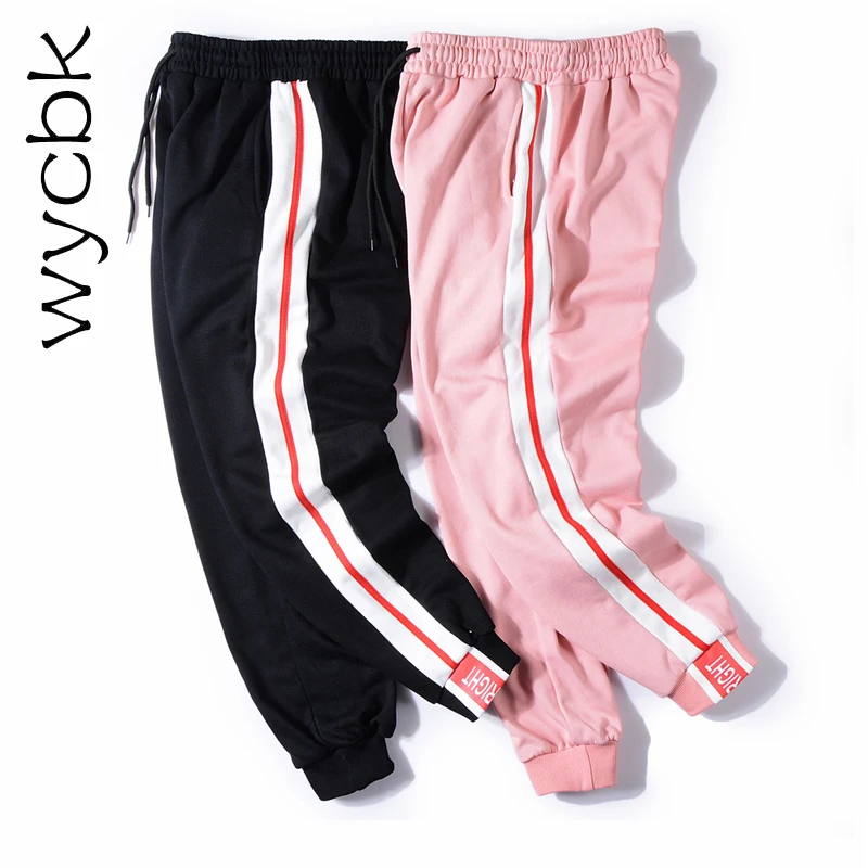black joggers with pink stripe