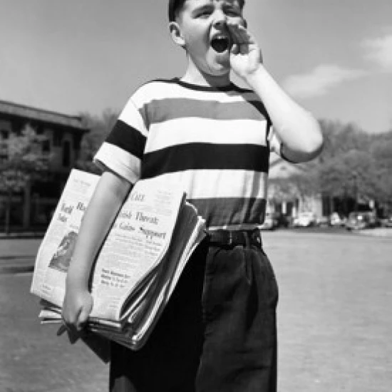 Boy selling newspapers Poster Print (24 x 36)