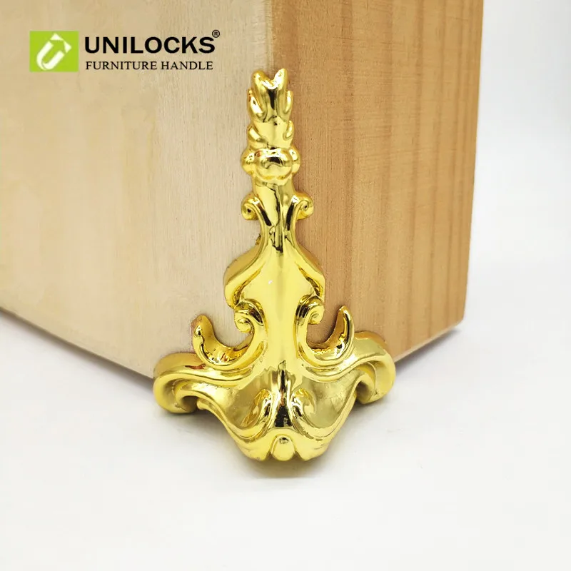 

UNILOCKS 52Pcs 65mm*42mm Wood Box Gold Feet Leg Corner Protector Triangle Decorative Bracket For Furniture Hardware Plastic
