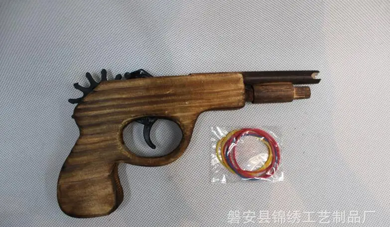 

1pcs New Style Toy Elastic Wood Guns Toy Rubber Band Bullet Guns Play Toys Pratical Jokes 002