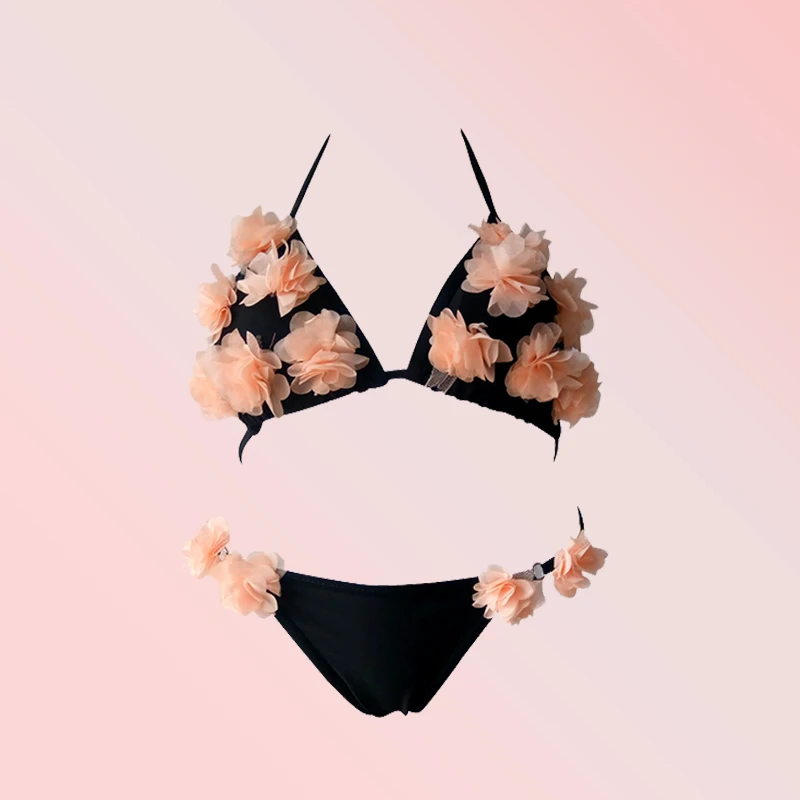 black swimsuit with pink flowers