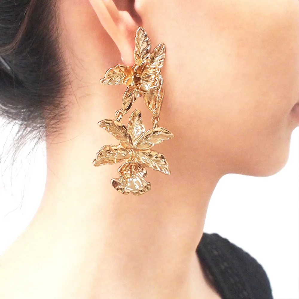 Gold flower statement earrings clearance