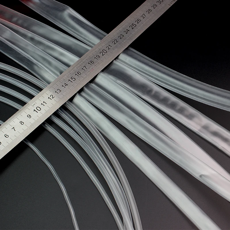 Tubes thermorétractables transparents enroulés, avec étiquette indiquant les diamètres 2-16mm, pour isolation de câbles.