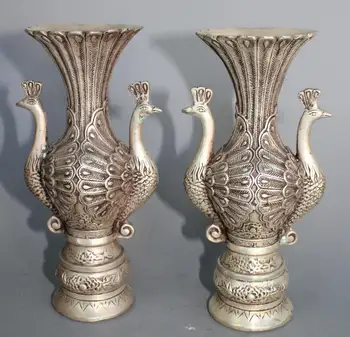 

Exquisitely carved Silver Peacock Vase a pair of Statue