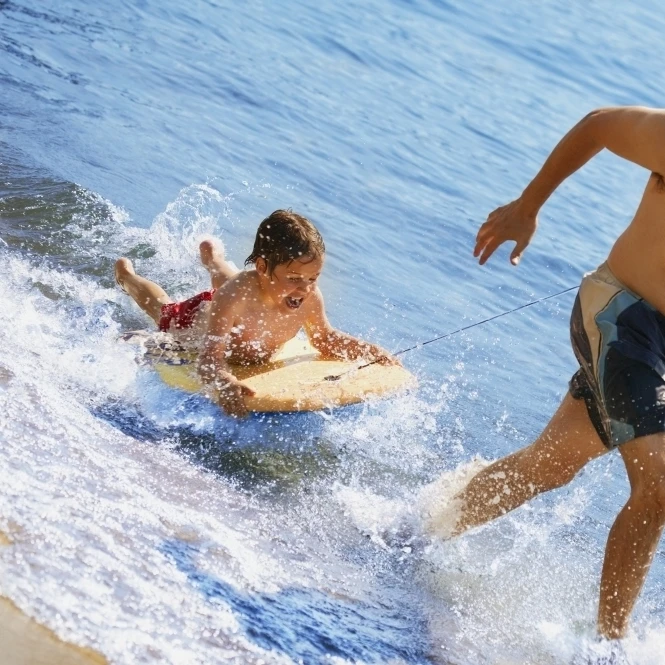 Playing In Water Poster Print (17 x 11)