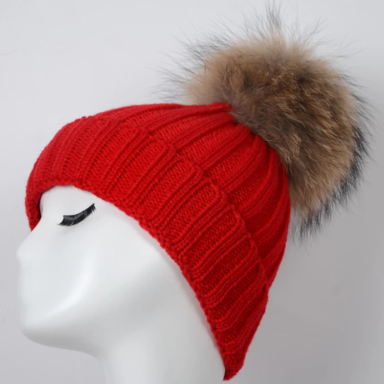hat with fur ball on top