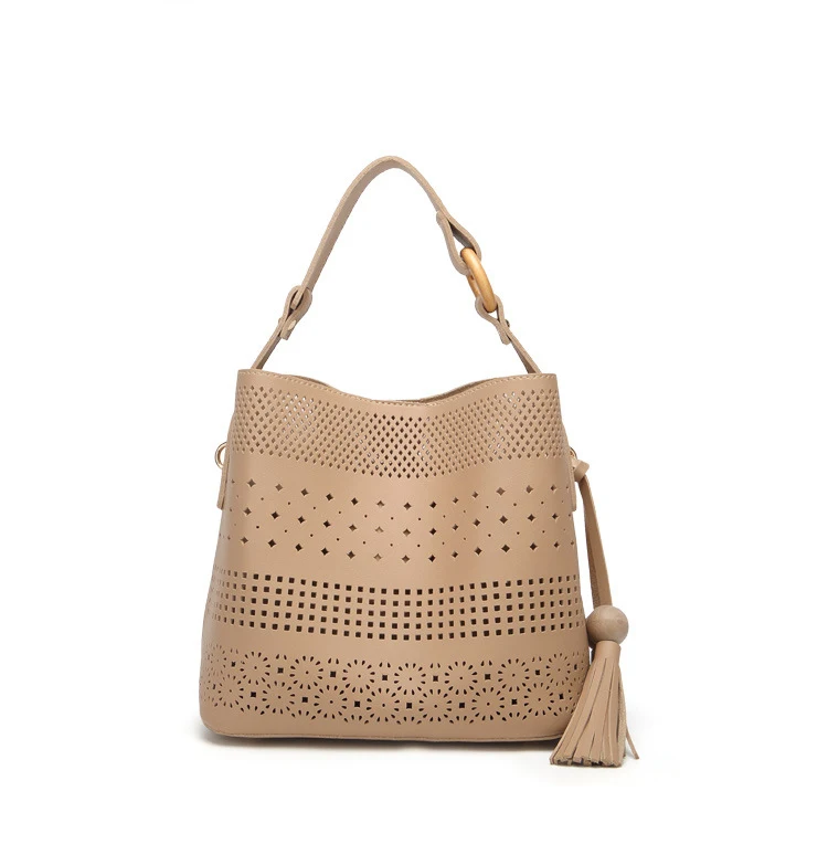 Preise 2019 neue Mode Straße Einfache Aushöhlen Design Schulter Tasche Cut Out Quaste Handtasche