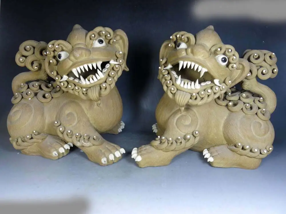 

A pair of China handmade fine sculpture guard pottery Foo Dogs Lion Statues