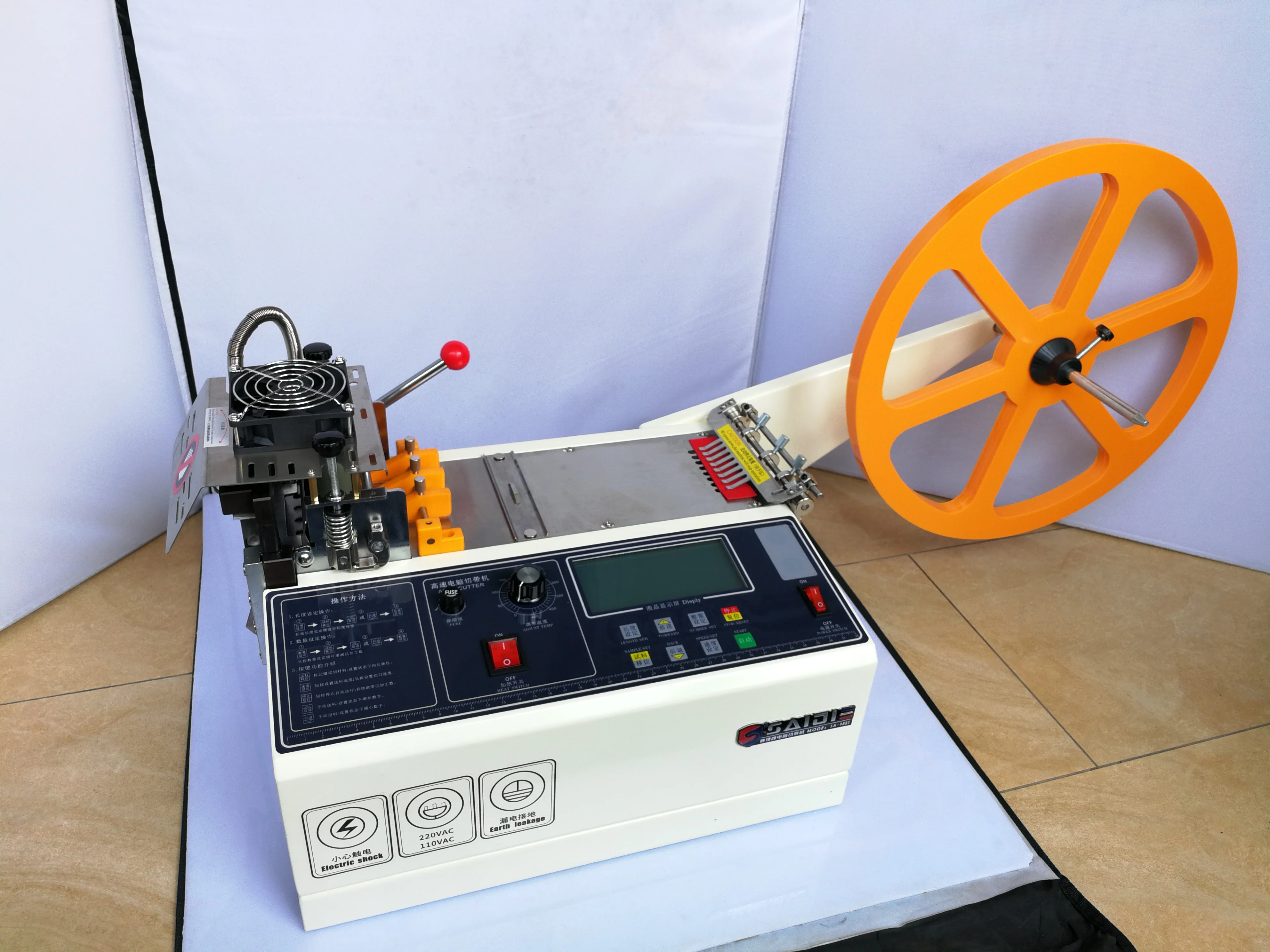 

988T automatic hot and cold Cloth belt cutting machine,Masks cloth, ear band, magic adhesive tape webbing elastic belt cutting