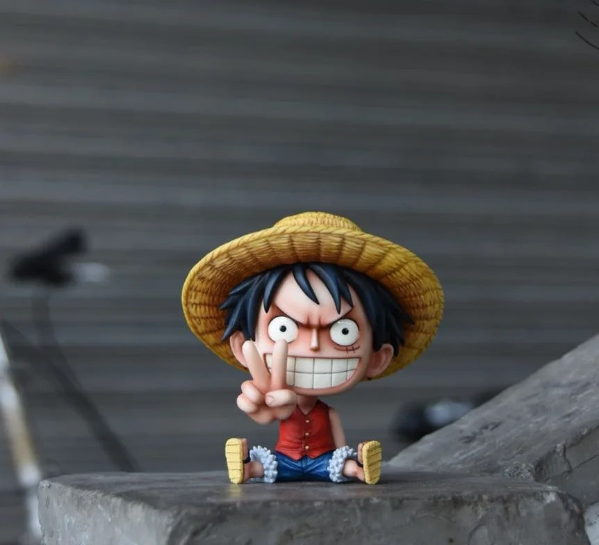

Anime One Piece Luffy Lovely Childhood Tooth Sitting Style PVC Action Figures OP Luffy Than Gesture Collectibles Model 10cm