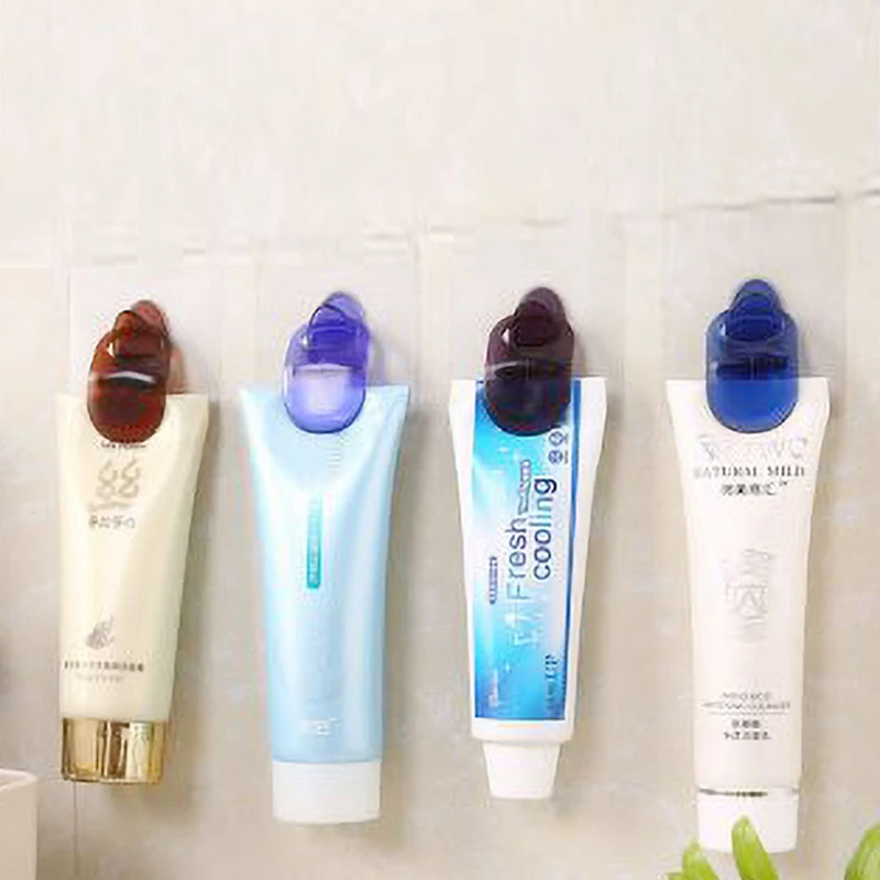 

1PC Toothpaste Clip Powerful Adhesive Sticker Hook Facial Cleanser Cleaning Storage Rack Cosmetics Hanger Bathroom Hanging Clip
