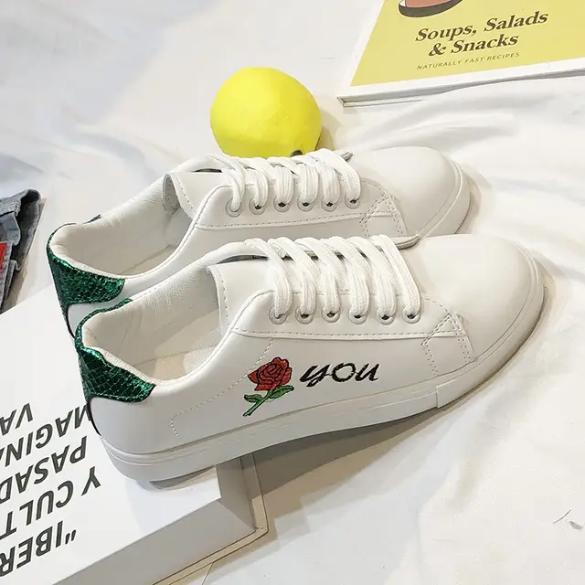 white sneakers with flowers