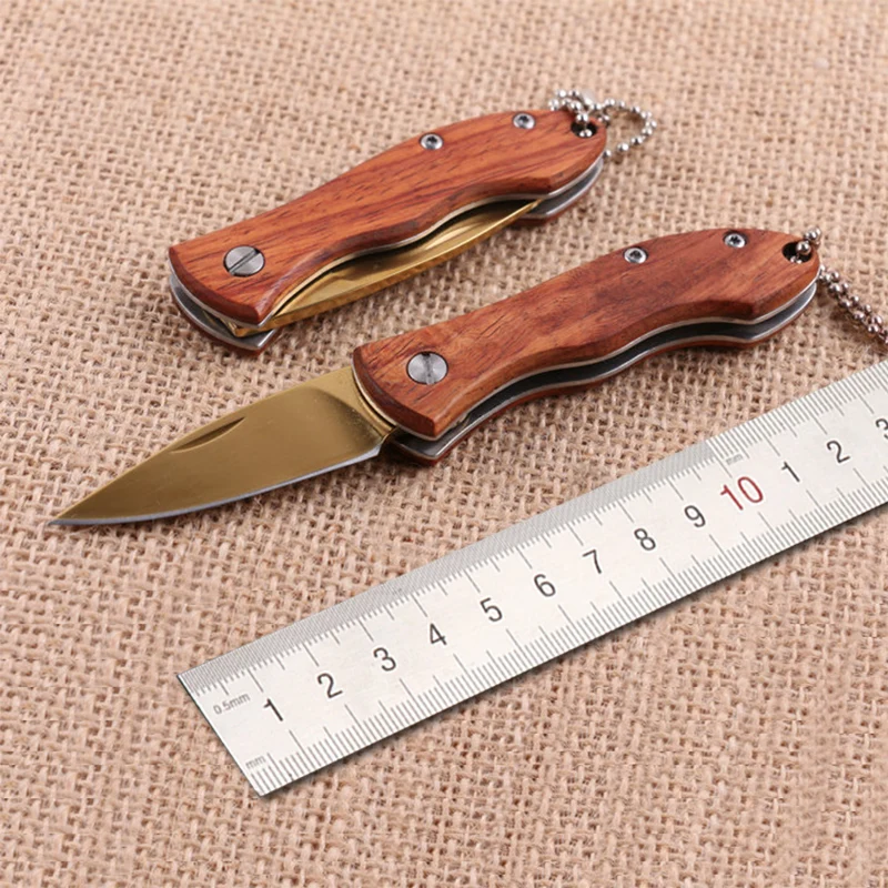 

Free shipping Titanium gold Folding Knife Wood Handle Survival Tactical Pocket Knife Small Camping Knives EDC Tools