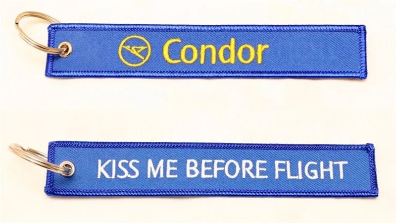 EM-1043B Condor Airlines KMBF embroidered keychain.  Metal ring and heavy duty nylon fabric tag.  Royal blue with gold Condor Airlines and white KMBF embroidered letter