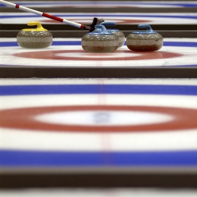 Curling Rocks On Ice Poster Print (12 x 17)