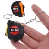 1 pieza creativa retráctil cinta niños altura medida llavero Mini bolsillo tirador métrico 1m llavero Color al azar ► Foto 1/6