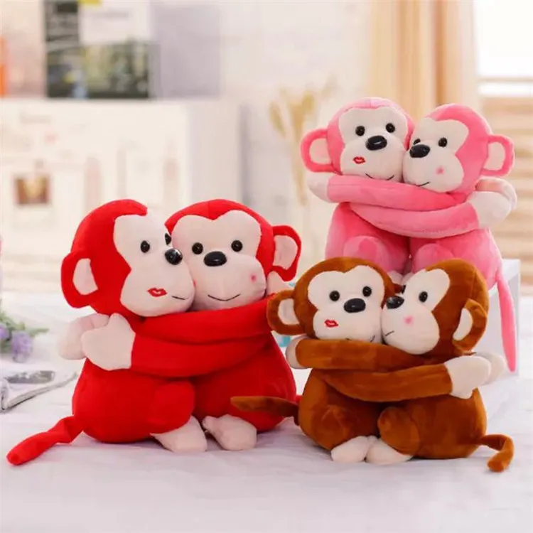 hugging stuffed monkeys