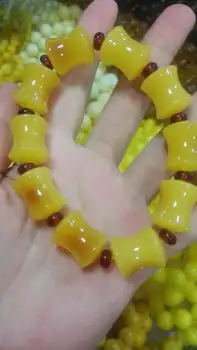 

Male and femalechicken oil stone Yellow Beeswax Hand Carved Amber Bracelet small vase barrel Bead Bracelets