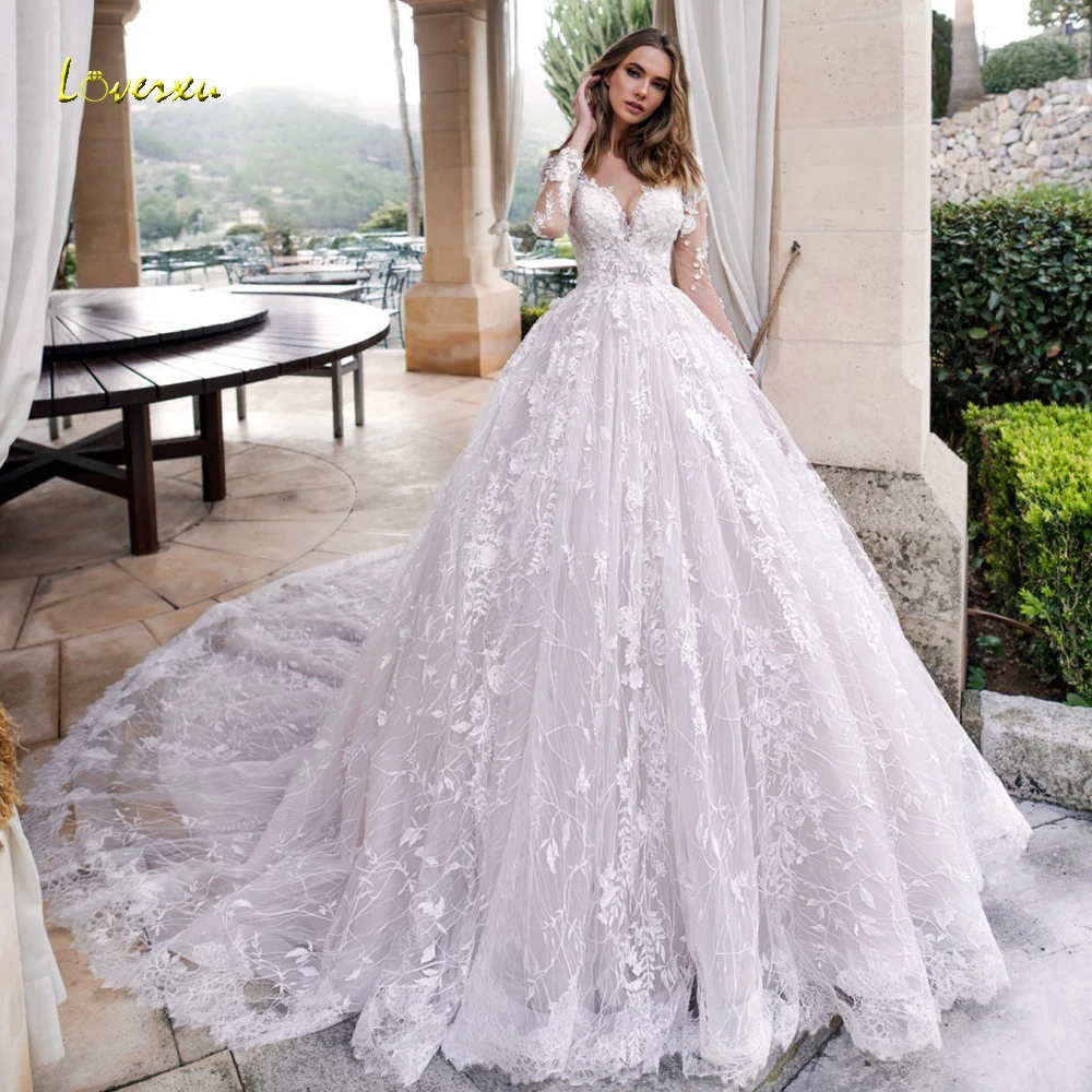 

Loverxu Luxury Long Sleeve Lace Princess Wedding Dresses 2019 V Neck Illusion Appliques Beaded Chapel Train Vintage Bridal Gowns