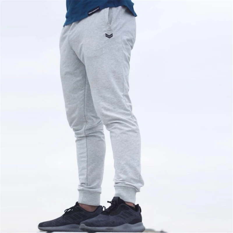 2019 رجل العلامة التجارية عداء ببطء Sweatpants رجل الجمنازيوم تجريب اللياقة البدنية سراويل قطنية الذكور عارضة الأزياء نحيل السراويل الترنك
