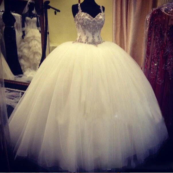 

2015 Romantic tulle Backless wedding dresses sexy spaghetti straps shiny bridal gowns sequins crystals puffy wedding gowns