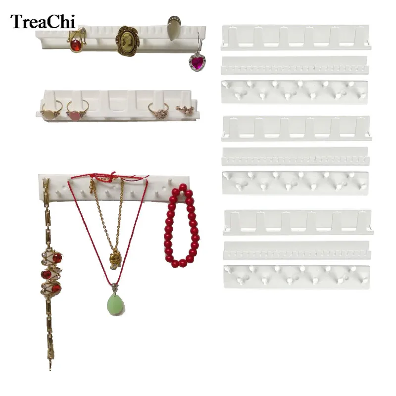 

Wholesale 9Pcs Plastic Jewelry Display Rack White Ring Earring Necklace Bracelet Organizer Free Sticky Hooks Wall Hanger Stand