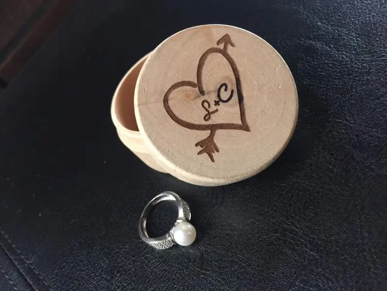 

The CUTEST wooden ring box customised just for you. His & hers initals with heart detailing! Perfect keepsake and gift for the