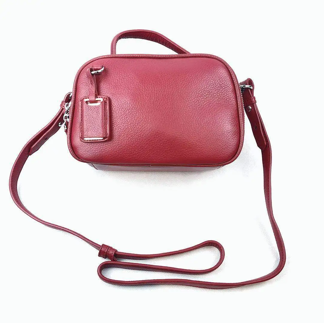 

New genuine leather cowhide handbag with one shoulder slanting and hanging decoration Korean version of leisure one shoulder